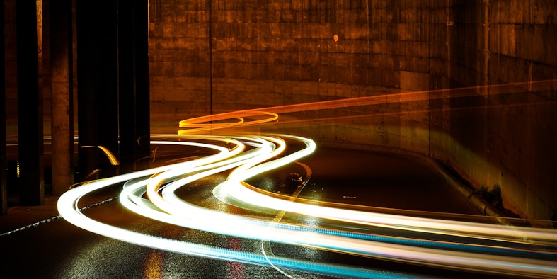 photographic long exposure of cars traveling thru a tunnel. Titled - Lights in the night. By Marc Sendra Martorell - https://unsplash.com/@marcsm